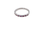 A white gold half hoop eternity ring. Set with seven round rubies and six brilliant cut white diamonds new