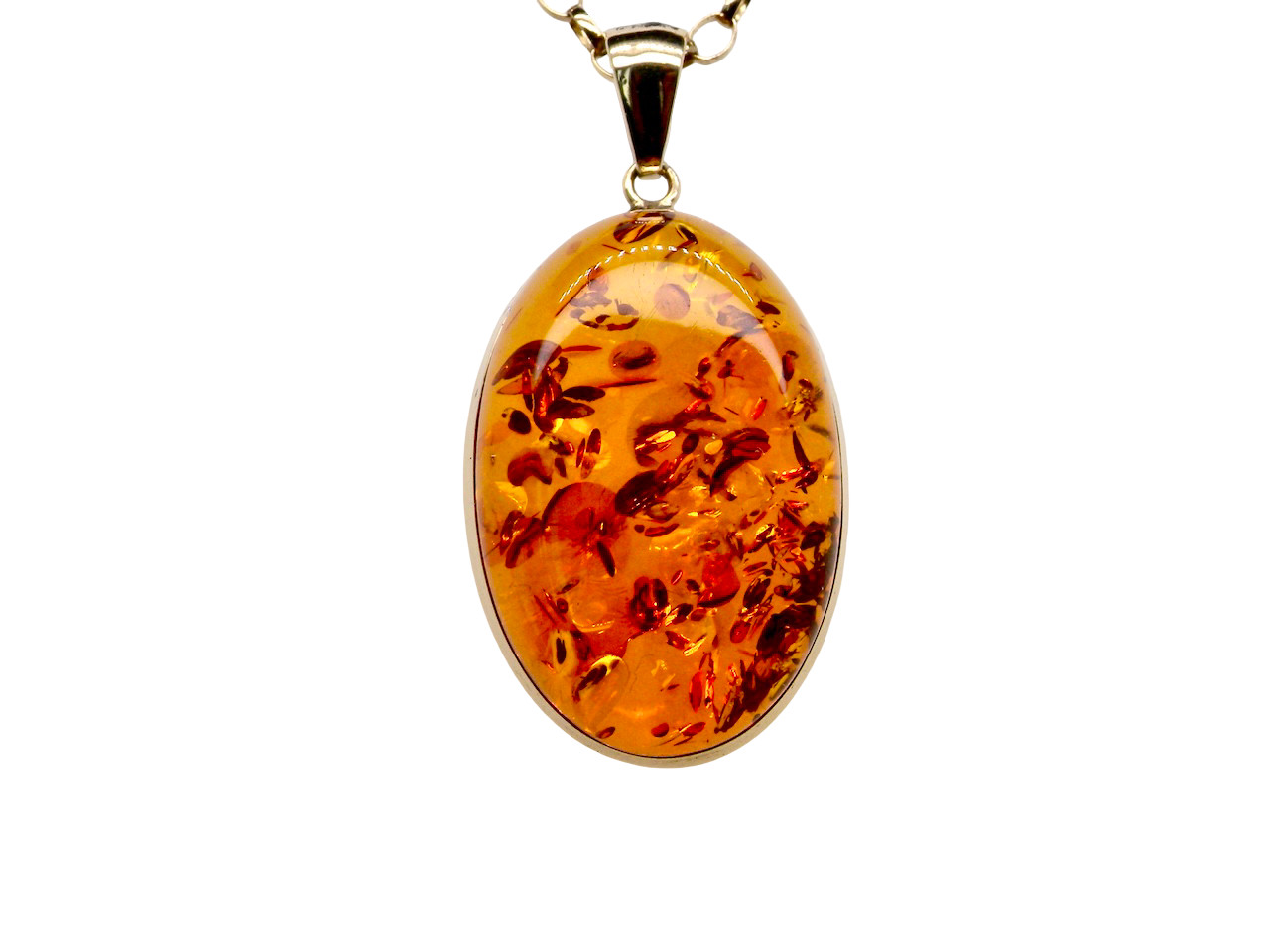 Amber pendant on a gold chain against a white background