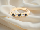 An 18 carat gold Sapphire and Diamond eternity ring