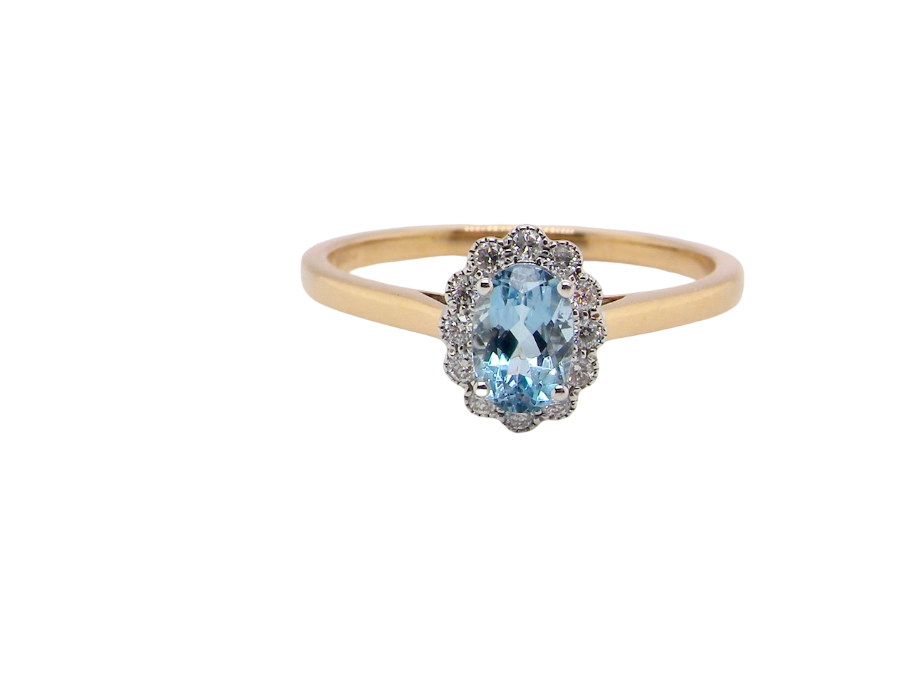 An 18 carat gold cluster ring. Set to the centre a lovely ice blue aquamarine 6x4mm, 
