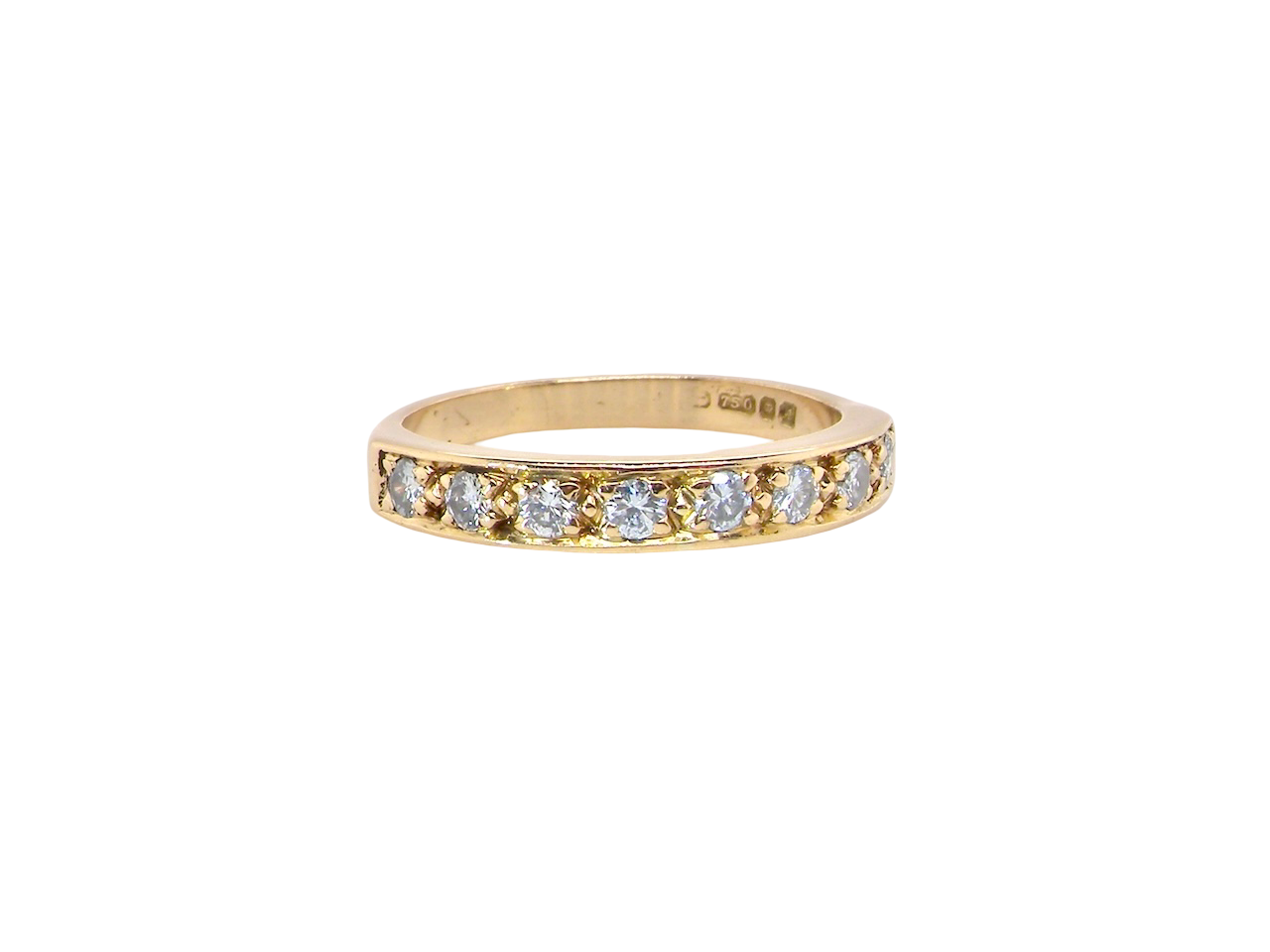 An 18 carat gold half-hoop eternity ring, set with eight brilliant-cut white diamonds