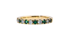 An 18 carat gold half-hoop eternity ring, set with&nbsp;round-cut emeralds
