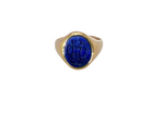 An 18 carat gold signet ring set with an oval lapis lazuli stone. This measures 12x9.5mm and has a carved intaglio seal engraved onto the stone. (These seem to be floral patterns)