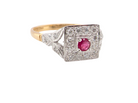 An 18 carat gold square cluster that features to the centre a round ruby and a halo of brilliant cut white diamonds.
