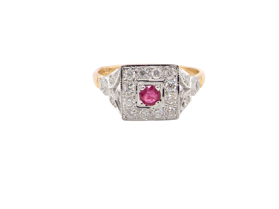 An 18 carat gold square cluster that features to the centre a round ruby and an outer halo of brilliant cut white diamonds.
