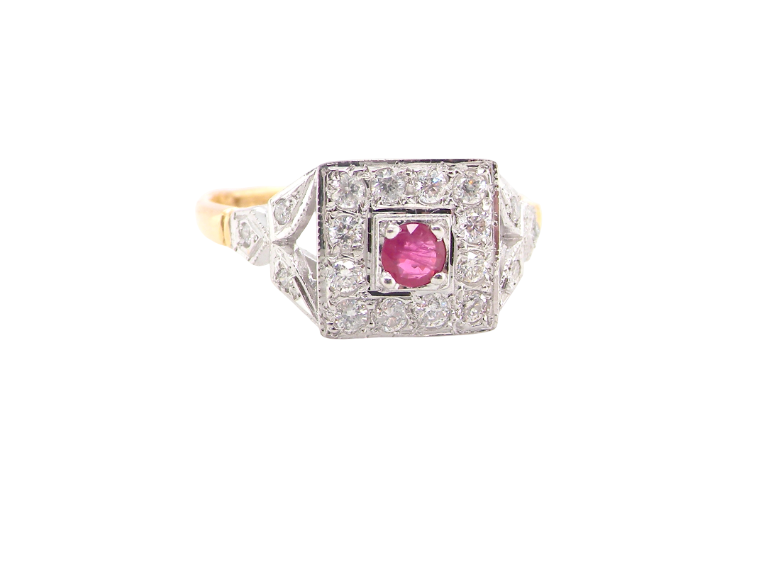 An 18 carat gold square cluster that features to the centre a round ruby and an outer halo of white diamonds.
