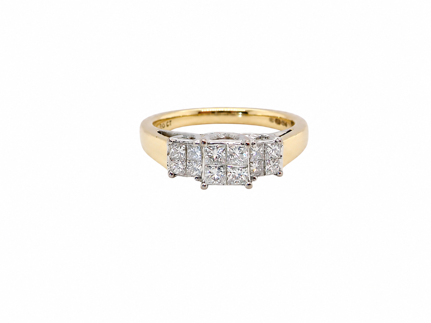 A yellow gold ring featuring a row of six diamonds, including a central round brilliant-cut diamond surrounded by five princess-cut diamonds, set on a plain white background.