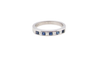 An 18 carat white gold half hoop eternity ring. Set with princess cut white diamonds, total of four- estimated 0.40 carats (2.4mm each) colour H-j, clarity Si.