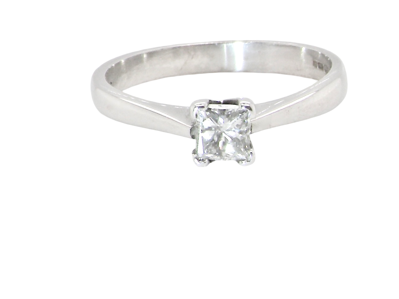 An 18 carat white gold solitaire ring that features a Princess Cut white diamond. Measures 4x4mm,&nbsp; (est 0.30 carats). Colour I-j, clarity Si
