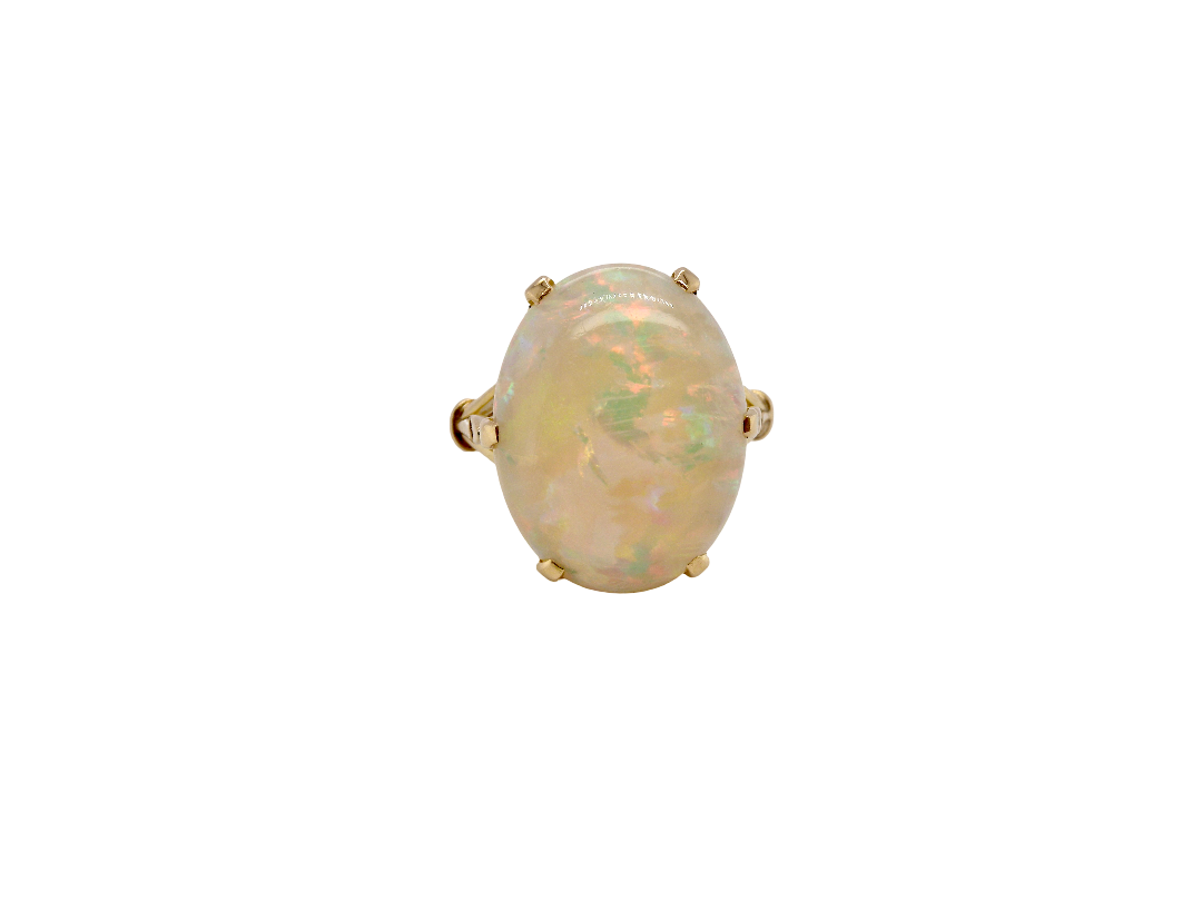 An 18 carat yellow gold* dress ring set with a large  opal gemstone.