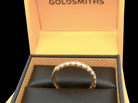 An 18 carat yellow gold half hoop diamond eternity ring originally purchased from Goldsmiths top view
