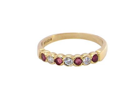 Yellow gold ruby and diamond half hoop ring