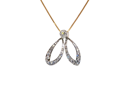 yellow gold* pendant. Features many diamonds, shaped like a dragonfly with openwork wings.