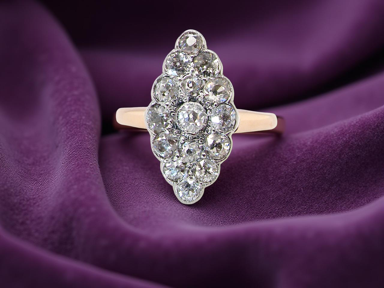  An Antique Marquise shaped Diamond Cluster Ring 