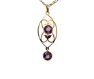 An Edwardian pendant set with two amethyst 