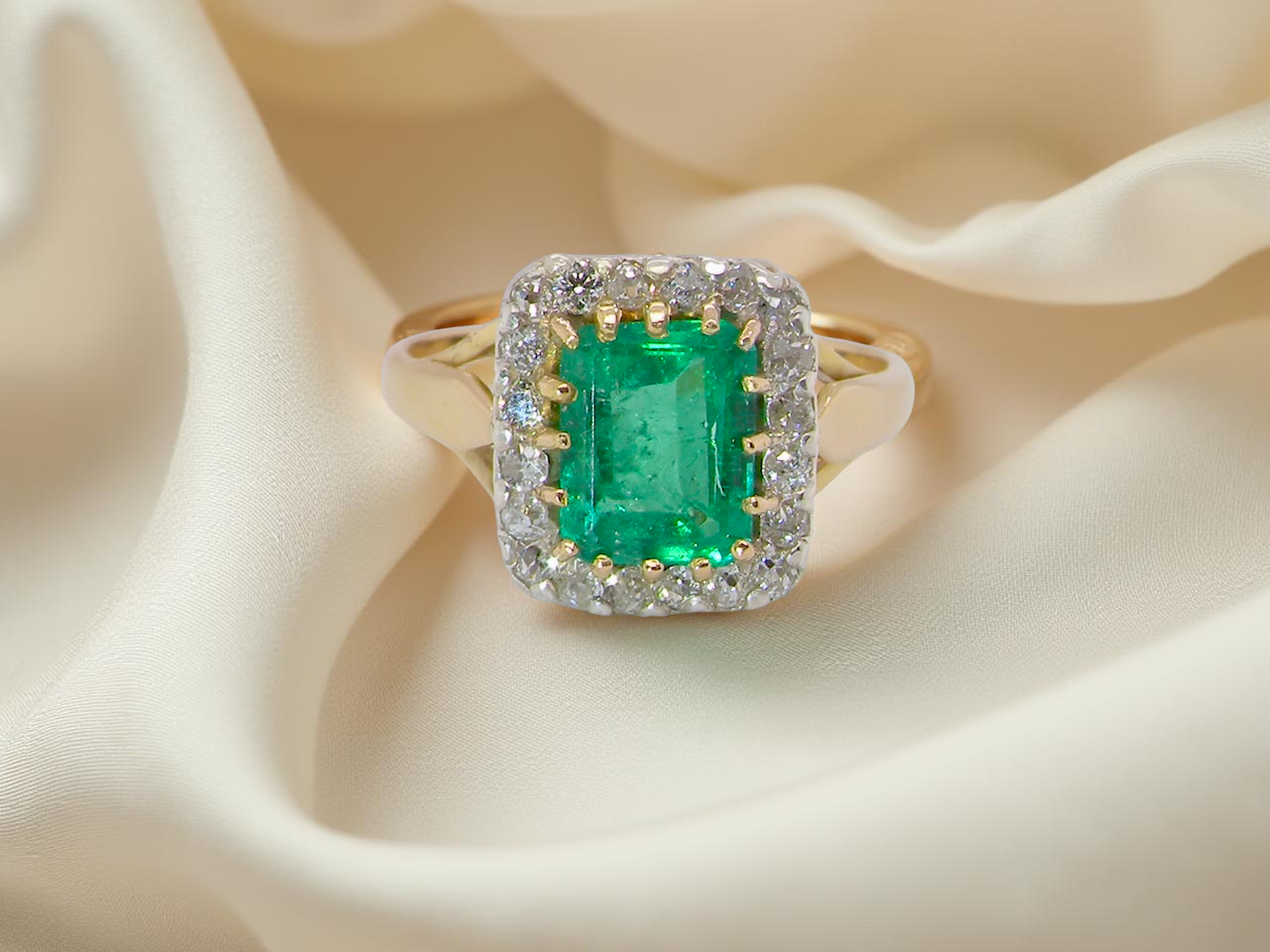 An Emerald and Diamond Cluster Ring, Circa 1950–1960