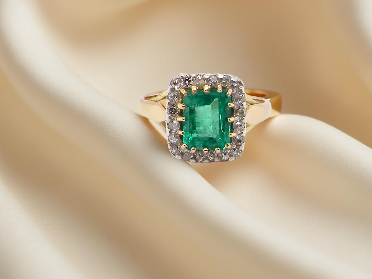 An Emerald and Diamond Cluster Ring, Circa 1950–1960
