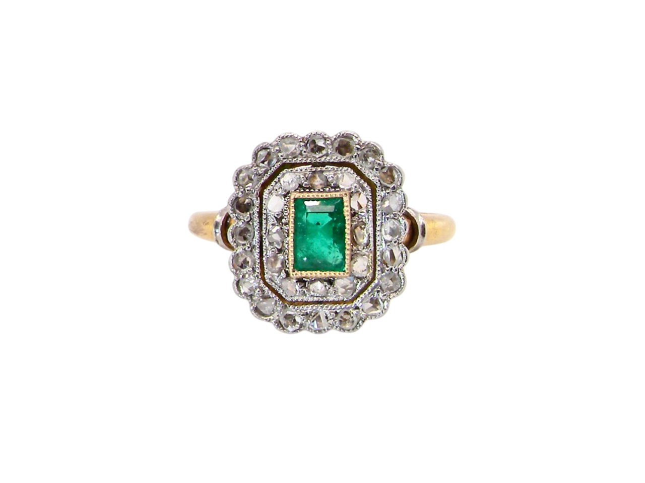 An antique Emerald and Diamond cluster ring