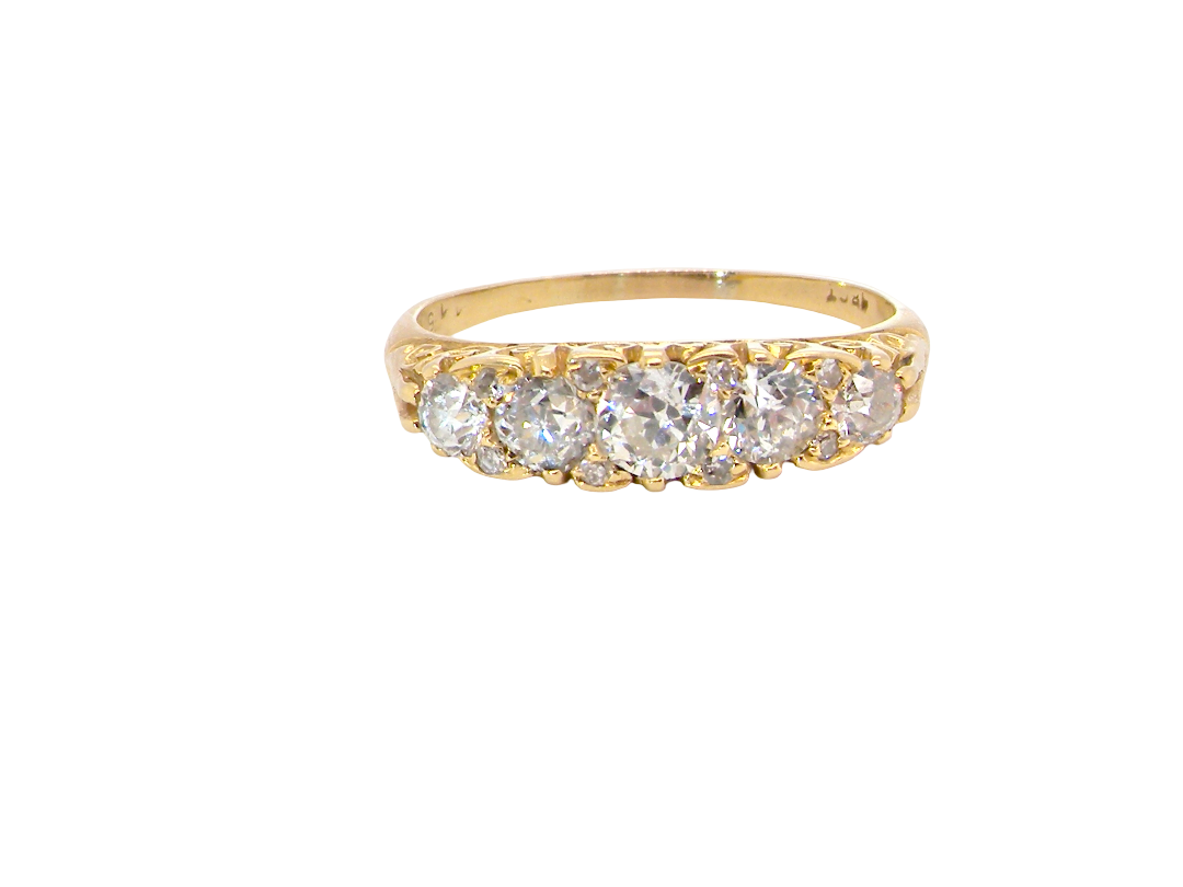 An antique boat shaped five stone ring. Set with five old cut white diamonds. Centre 5mm (0.45-0.50 carats) each side a 4mm stone, at each end a 2.4mm stone. 