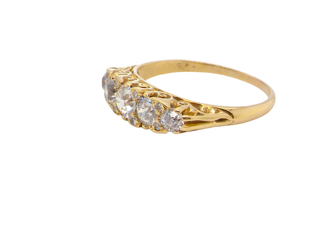 An antique boat shaped five stone ring. Set with five old cut white diamonds. Centre 5mm (0.45-0.50 carats) each side a 4mm stone, at each end a 2.4mm stone. Total diamond content one carat.
