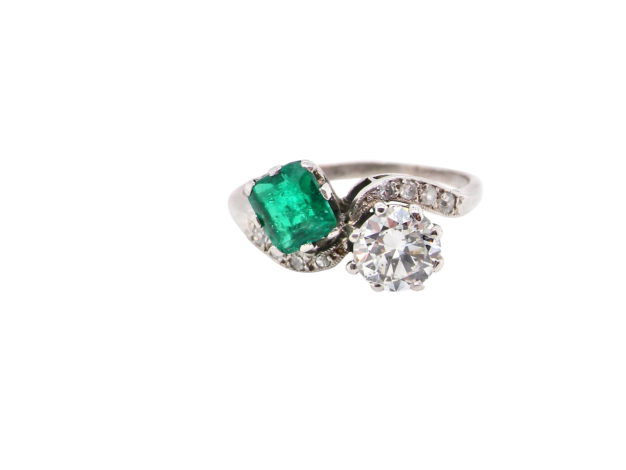 An antique two stone Emerald and Diamond ring