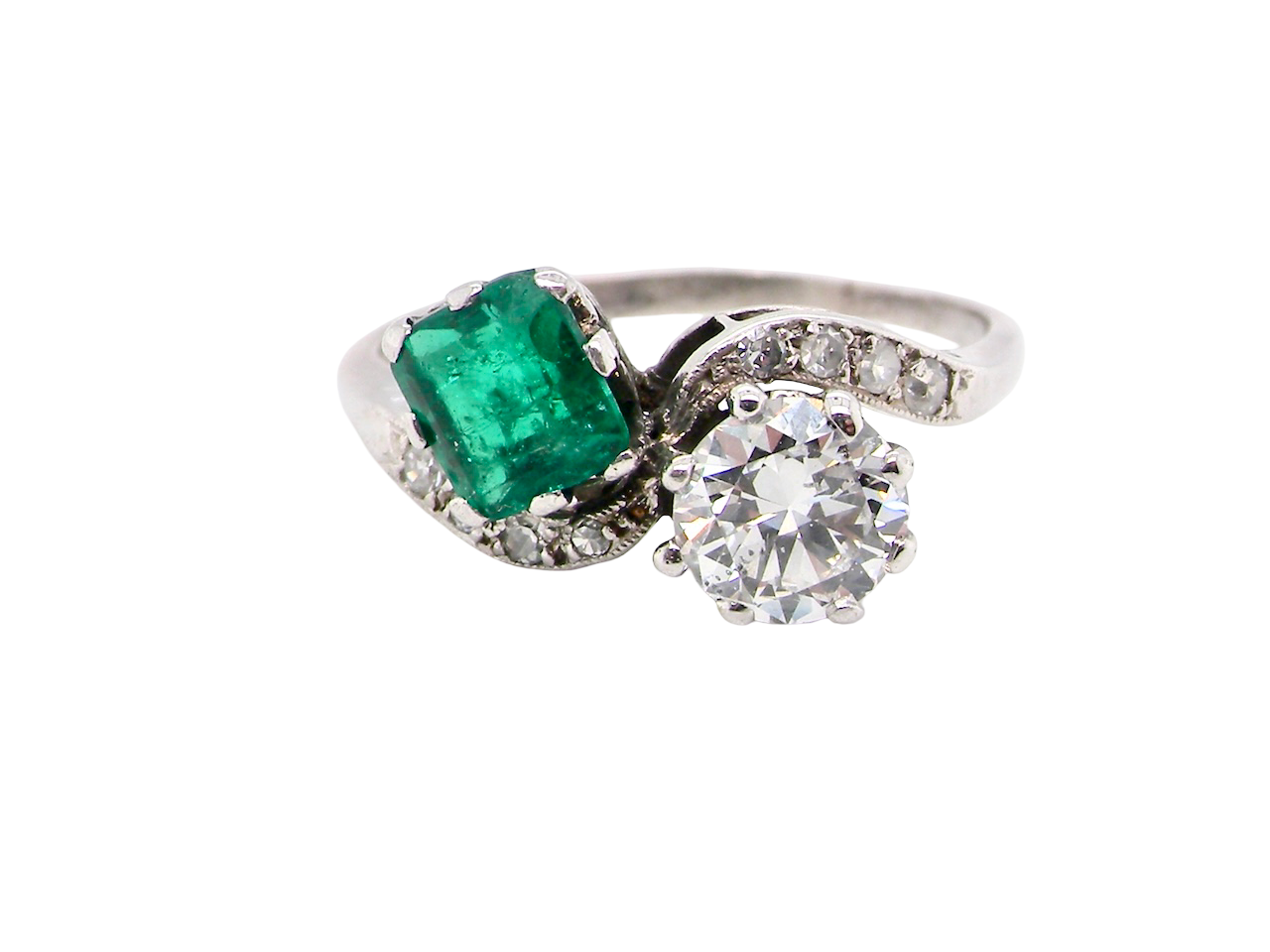An antique two stone Emerald and Diamond ring