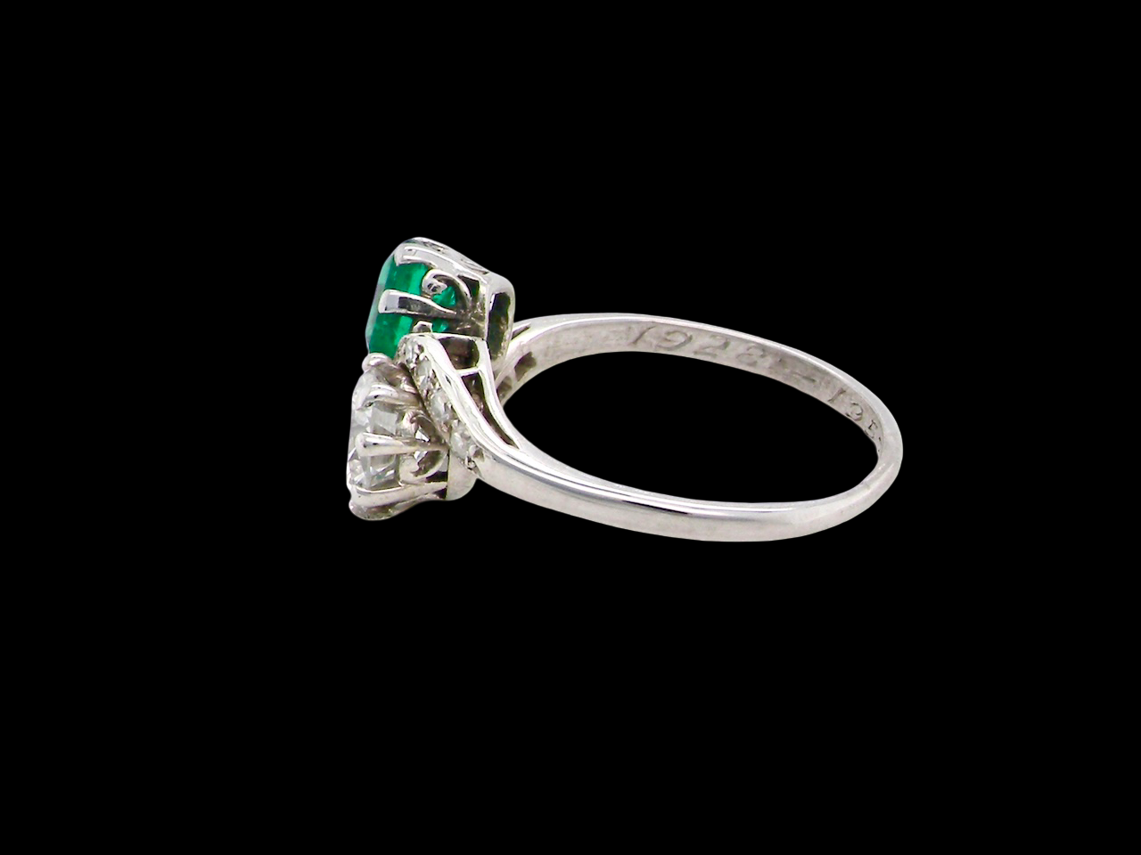 An antique two stone Emerald and Diamond ring