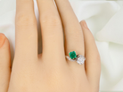 An antique two stone Emerald and Diamond ring