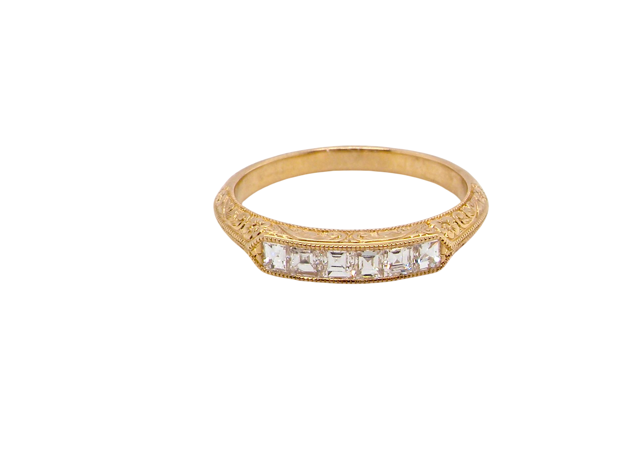 An attractive half hoop diamond eternity ring. Set with six step cut white diamonds, tbhat sit side by side, the colour estimated at H-i, clarity Si.