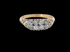 An eight stone boat shaped diamond ring, with two extra 'accent' diamonds