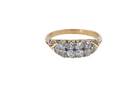 An eight stone boat shaped diamond ring, with two extra 'accent' diamonds to each end