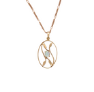 An elegant Art Deco style pendant featuring a beautiful oval opal measuring 6 × 4 mm, displaying a lovely play of colour.