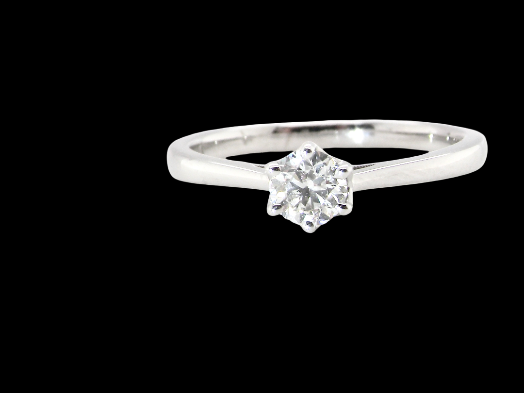 An elegant and timeless 18 carat white gold diamond solitaire ring, featuring a beautiful brilliant cut white diamond, independently certified by the Gemological Institute of America 