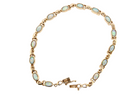 An elegant line bracelet set with fourteen oval opals, each measuring approximately 5 x 3 mm, displaying a pleasing and lively play of colour.