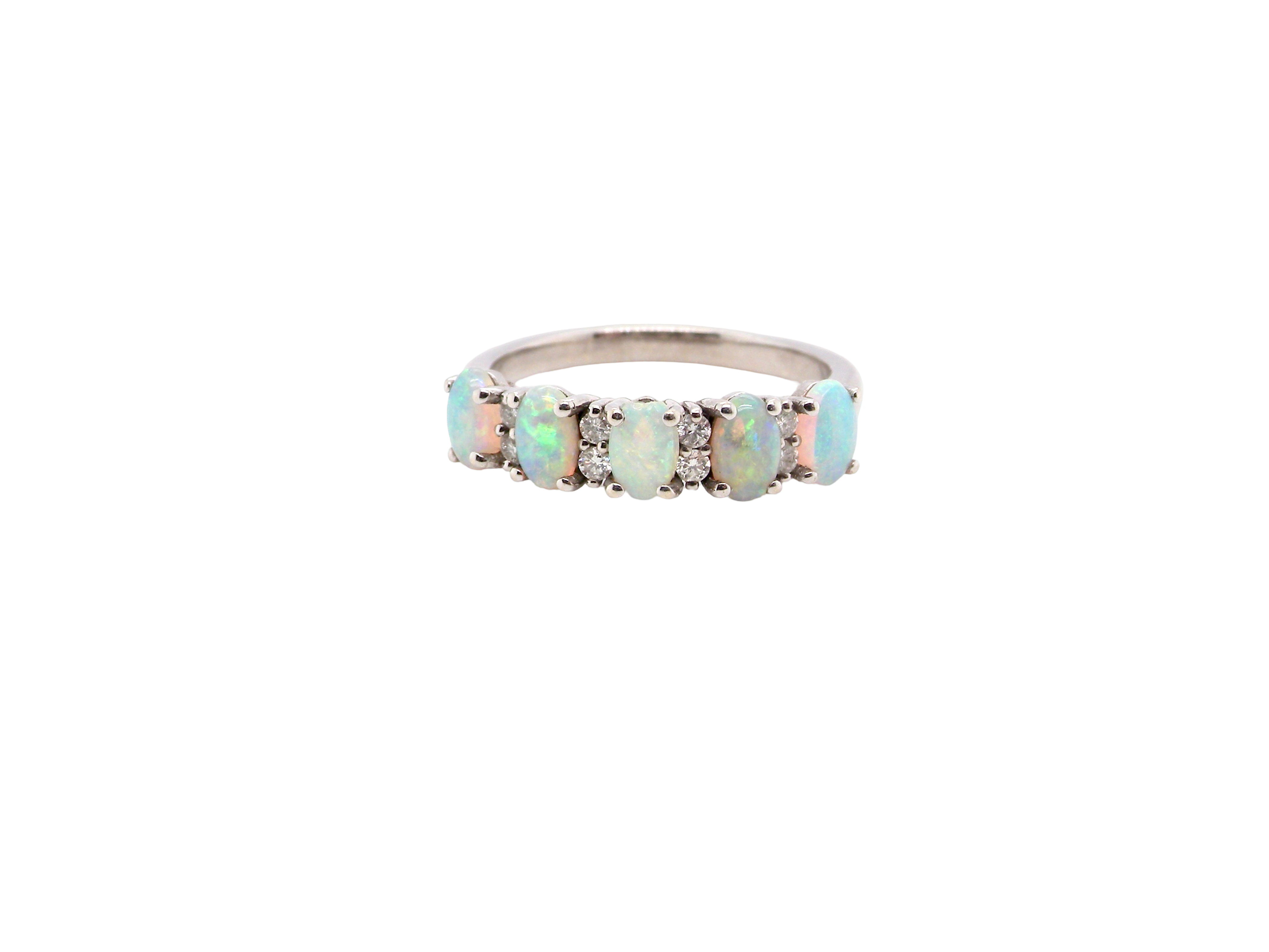 An elegant opal and diamond half hoop ring, featuring five oval opals with lively play of colour. Each opal measures 5 x 3mm, with an estimated total opal weight of approximately 0.75 carats, all claw set to maximise light and colour.