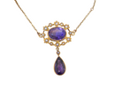 An elegant pendant from the late part of the 19th century. This Victorian pendant features two luxurious amethyst gemstones, 