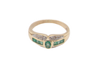 An emerald and diamond dress ring