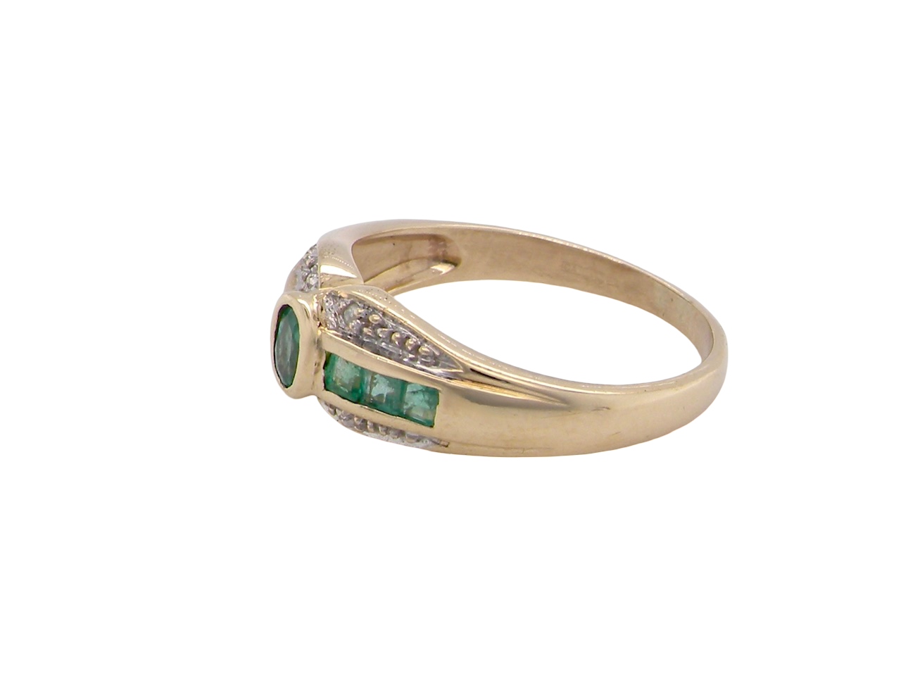 An emerald and diamond dress ring