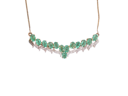 An emerald and diamond feature necklace