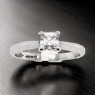 An emerald cut platinum solitaire Diamond Ring