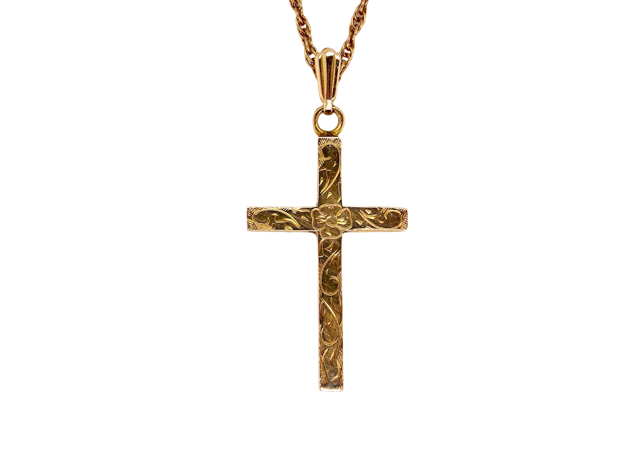 An engraved 9 carat gold cross