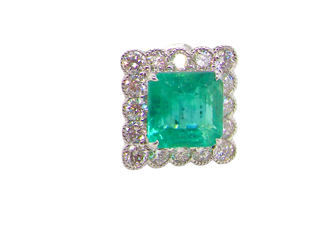 An exceptional pair of cluster earring Each of these beautiful earrings is set with a stunning square cut emerald, measures 7x7mm (est carat size 1.8 carats) excellent colour and clarity with just a few inclusions.