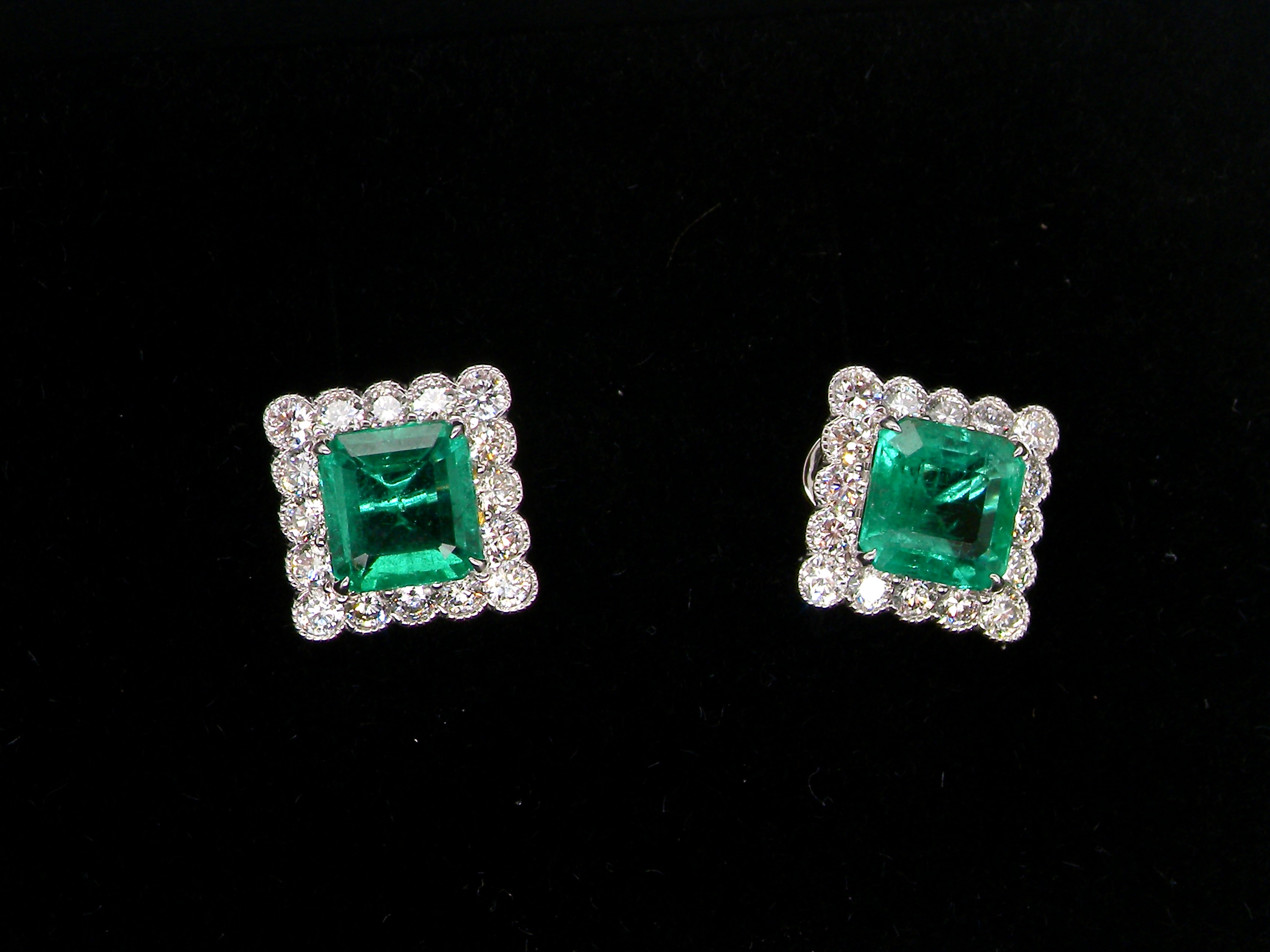An exceptional pair of cluster earrings. Each of these beautiful earrings is set with a stunning square cut emerald, measures 7x7mm (est carat size 1.8 carats) 