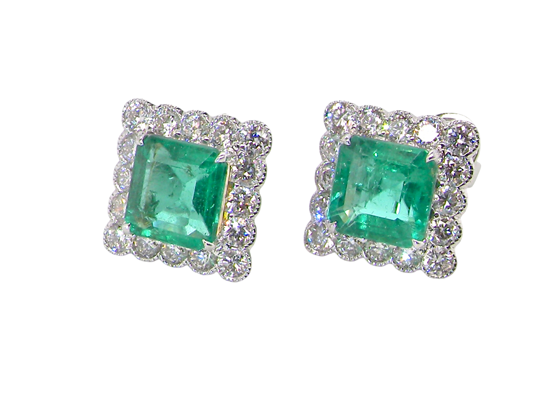 An exceptional pair of cluster earrings. Each of these beautiful earrings is set with a stunning square cut emerald, measures 7x7mm (est carat size 1.8 carats) excellent colour and clarity with 