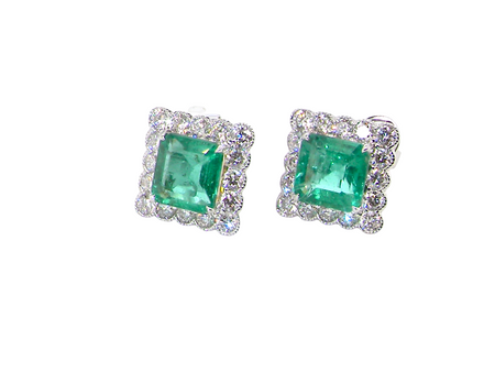 An exceptional pair of cluster earrings. Each of these beautiful earrings is set with a stunning square cut emerald, measures 7x7mm (est carat size 1.8 carats) excellent colour and clarity with just a few inclusions.
