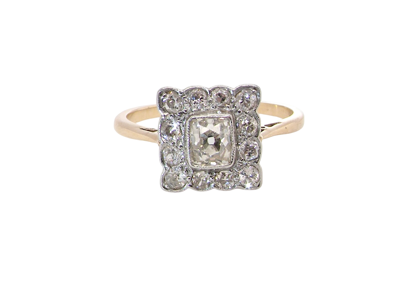  An exquisite Art Deco diamond cluster ring, beautifully handcrafted and rich in period charm.

At its centre sits a striking rectangular cut diamond measuring approximately 5 x 4.8mm, 