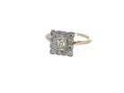  An exquisite Art Deco diamond cluster ring, beautifully handcrafted and rich in period charm.

At its centre sits a striking rectangular cut diamond measuring approximately 5 x 4.8mm, estimated at 0.50 carats, 