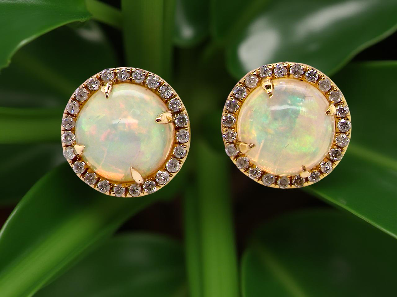 An exquisite pair of opal and diamond earrings