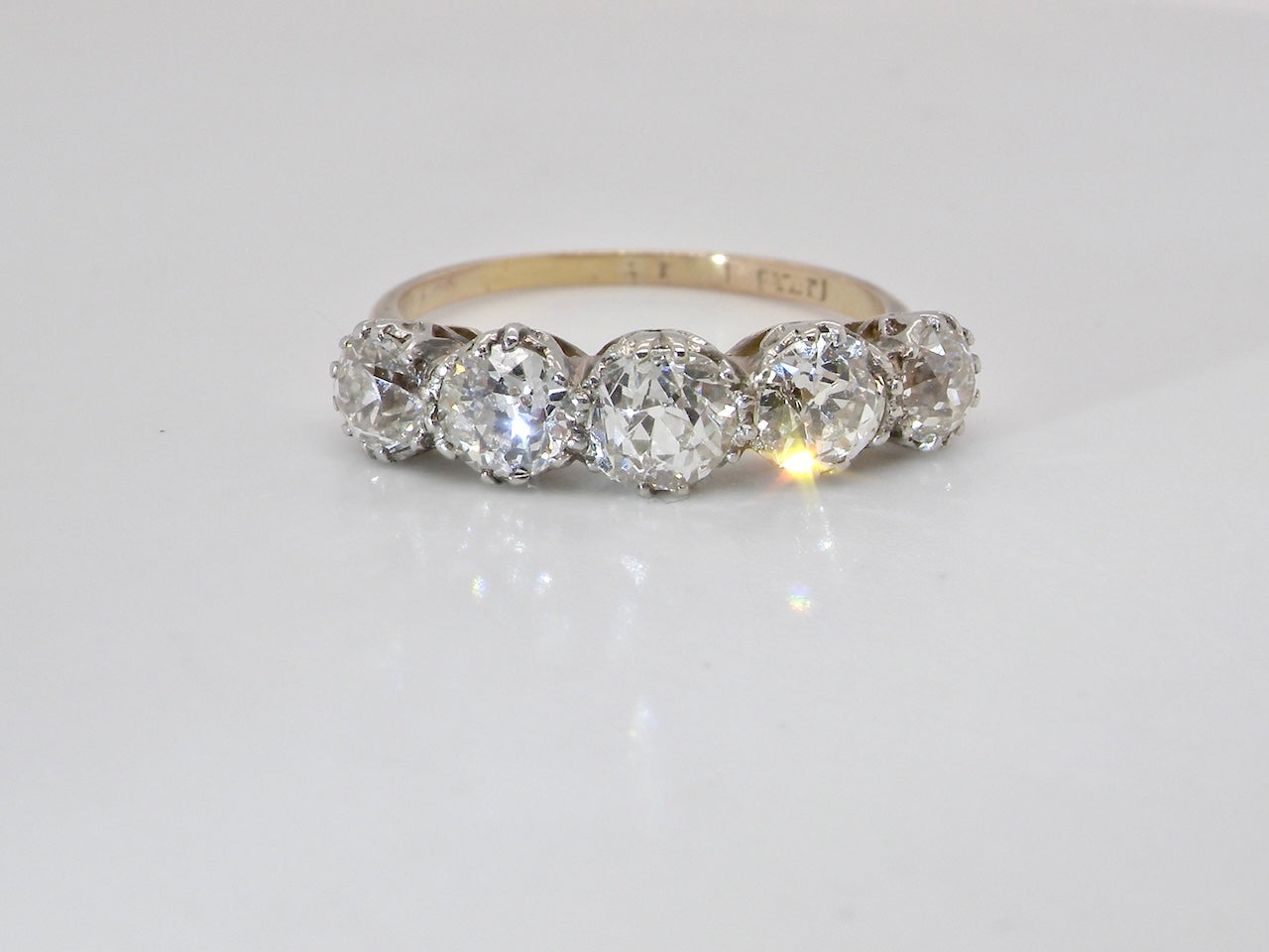 An impressive early 20th-century ring set with five white diamonds.