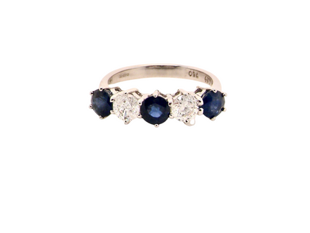 An impressive five stone Sapphire and Diamond ring